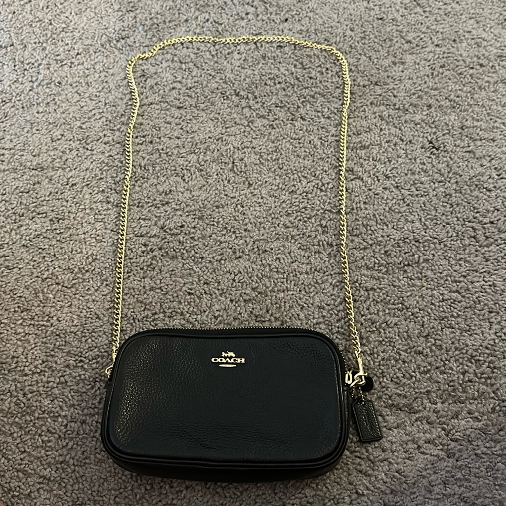 Small black Coach satchel bag with removable gold chain strap.